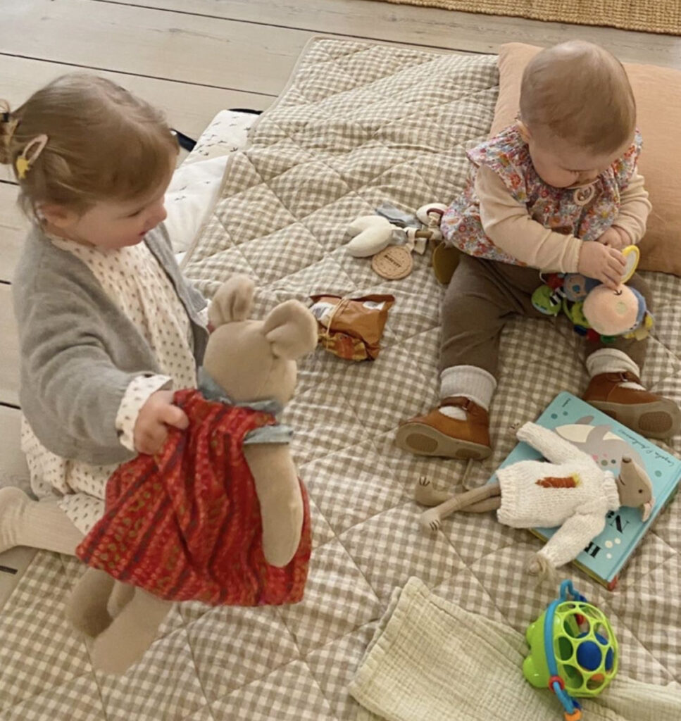 babies-using-fine-motor-skills-to-play-with-toys